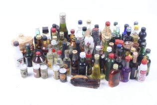 A collection of miniature alcohol bottles. Including Irish Mist liqueur, Scrumpy, Drambuie, etc.
