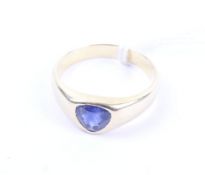 A vintage gold and sapphire single stone gypsy ring.