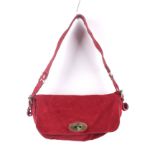 A Mulberry red suede flap shoulder bag.