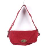 A Mulberry red suede flap shoulder bag.