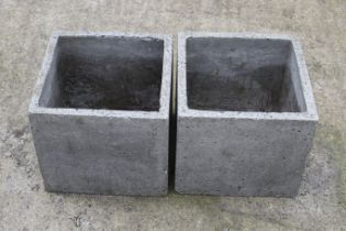 Two concrete square garden planters.