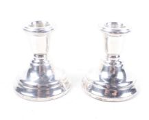 A pair of vintage silver short round candlesticks.