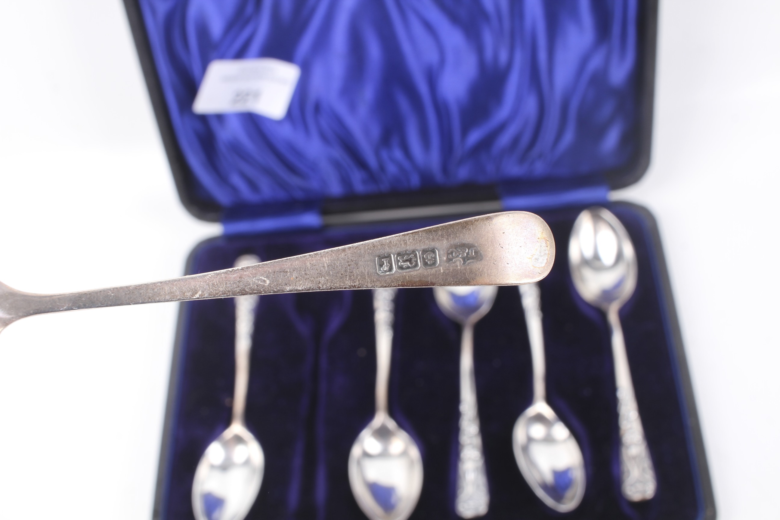 A collection of small silver spoons and a pair of sugar tongs. - Image 2 of 2