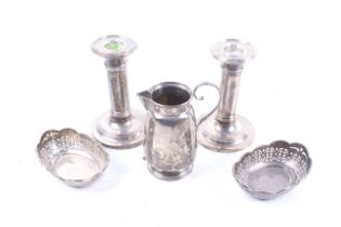 A pair of silver short round column dressing table candlesticks and other items.