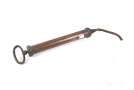 Railwayana - B R (M) stamped copper syringe type gease gun. 56cm long.