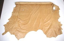 A large roll of tan leather.