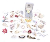 A collection of approximately 35 costume jewellery 'Flowers and leaves' brooches and other