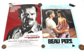 A collection of assorted late 20th century film posters.