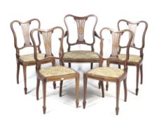 A set of five Victorian black walnut bow back chairs.
