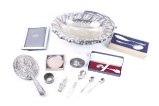 A collection of silver and white metal items.