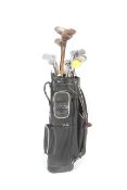 A collection of vintage golf clubs and golf bag.