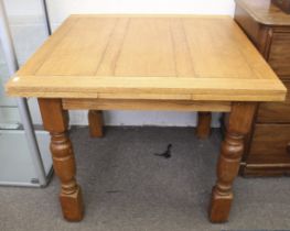 A 20th century pine extendable table.