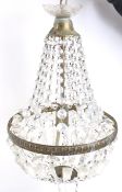 A 20th century tent and bag style crystal glass and brass chandelier. With a single electric light.