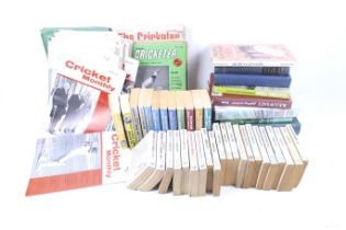 A collection of cricket related books and annuals.