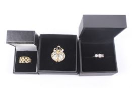 Three boxed items of yellow metal jewellery.