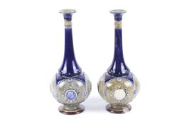 A pair of Royal Doulton Lambeth vases.