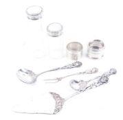 A collection of hallmarked silver and white metal items including napkin rings,