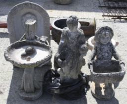 A group of six assorted reconstituted stone garden ornaments.