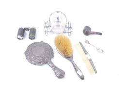 A silver mounted round hand mirror and other items.