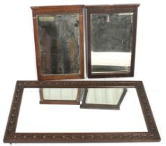 Three Victorian and later oak framed bevelled edge wall mirrors.