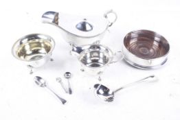 A silver old English bead sauce ladle and various silver-plated items including a sauce boat.