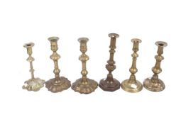 Six 19th century and later brass candlesticks.