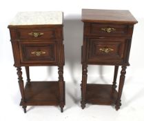 Two similar bedside cabinets.