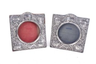 A pair of silver mounted square photograph frames.