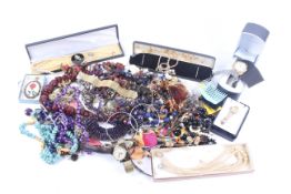 A collection of miscellaneous costume jewellery and various wrist and bracelet watches.