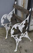 An oranmental white painted metal garden seat. With hop and leaf decoration. H81cm. (AF).