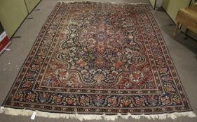 A large red and blue ground Iranian rug.