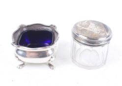 A silver small oblong salt cellar and a dressing table pot.