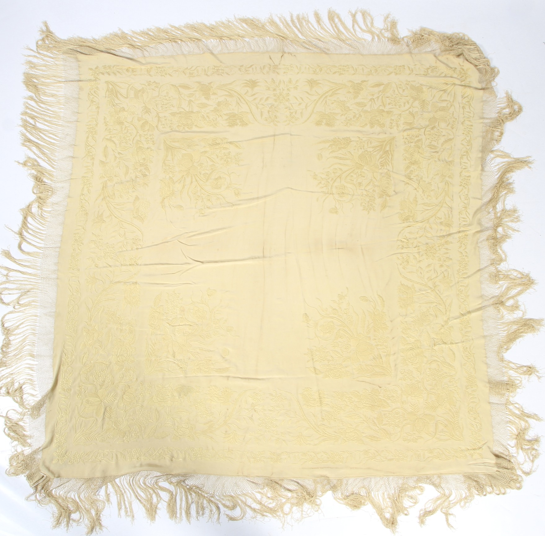 A 20th century cream silk shawl.