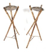 A pair of Victorian bamboo tri-form plant stands with toleware painted tin trays.