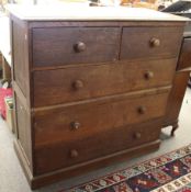 Two part Edwardian oat chest of drawers. Two over three long drawers, on a plinth base.