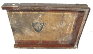 The top of a vintage wooden travelling trunk.