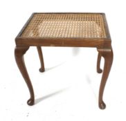 A mahogany and rattan stool or side table.