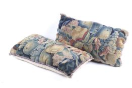 Two fragments of 17th or 18th century Flemish tapestries converted into a pair of cushions.