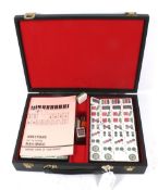 A contemporary Mah-jong Chinese game in a fitted case. With counters, dice and instruction booklet.