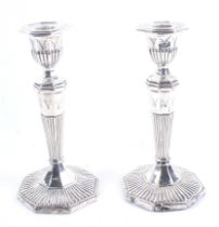 A pair of late Victorian silver octagonal candle sticks.