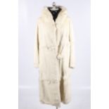 A vintage long white rabbit fur coat.