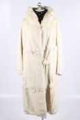 A vintage long white rabbit fur coat.