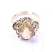 A vintage 9ct gold and oval citrine single stone ring. Hallmarks for Birmingham 1974, size M+, 4.