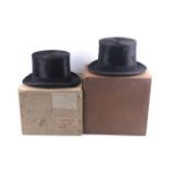 Two Lincoln Bennett & Co black silk top hats and a pair of gloves.