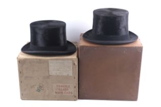 Two Lincoln Bennett & Co black silk top hats and a pair of gloves.