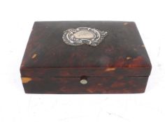 A 19 th century Tortoiseshell box in the Lund style opening to reveal green silk and velvet lining