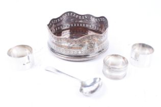 A silver napkin ring and other items.