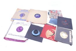 A collection of 78s and 7 inch vinyl 45 rpm single records.