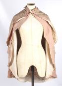 An early 20th century pink cotton shoulder cape.