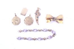 A collection of vintage gold jewellery including an Edwardian floral-engraved ribbon-tied bow fob.